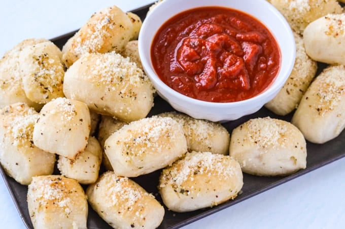 Parmesan Bread Bites with a bowl of marinara.