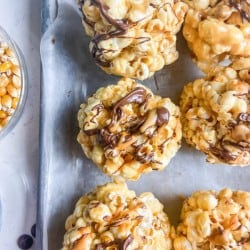 Peanut Butter Popcorn Balls drizzled with chocolate and PB2 Organic Powdered Peanut Butter.