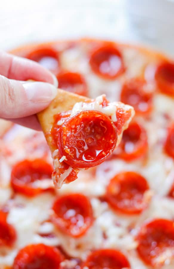 Pepperoni Pizza Dip on a pita chip.