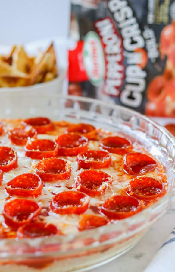 Pie plate full of a cheesy dip appetizer.