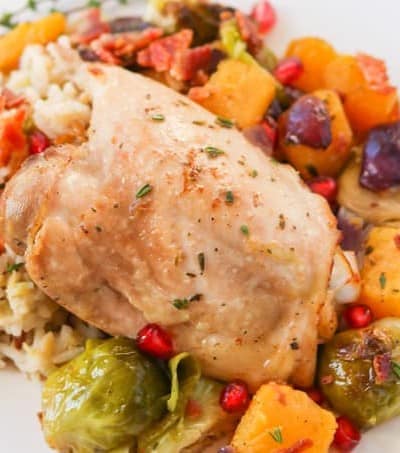 A plate of cooked chicken and vegetables.