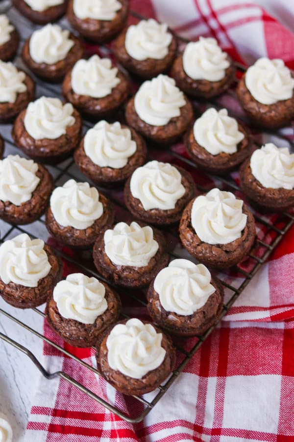 Small brownies with frosting.