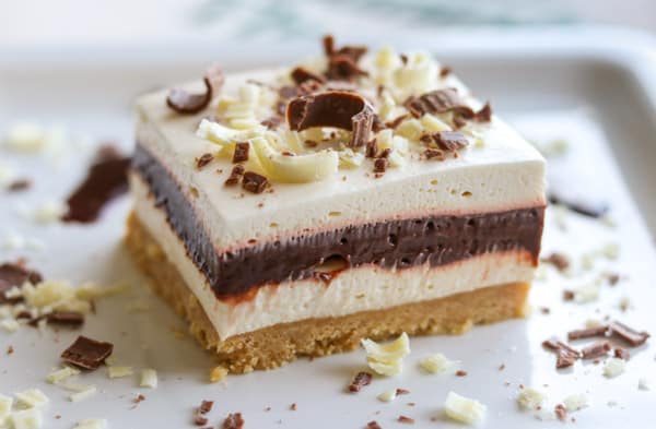 Layers of cookie crust, Irish cream cheesecake, chocolate pudding and whipped cream.