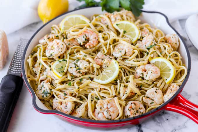 A pan of pasta with shrimp.