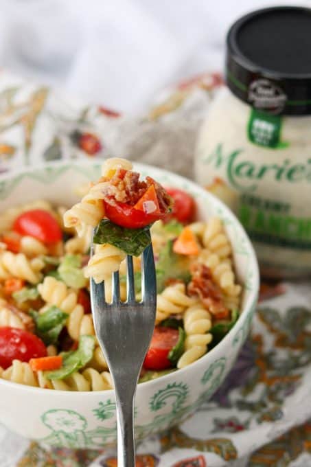 A forkful of Bacon Pasta Salad made with Marie's Creamy Ranch Dressing.
