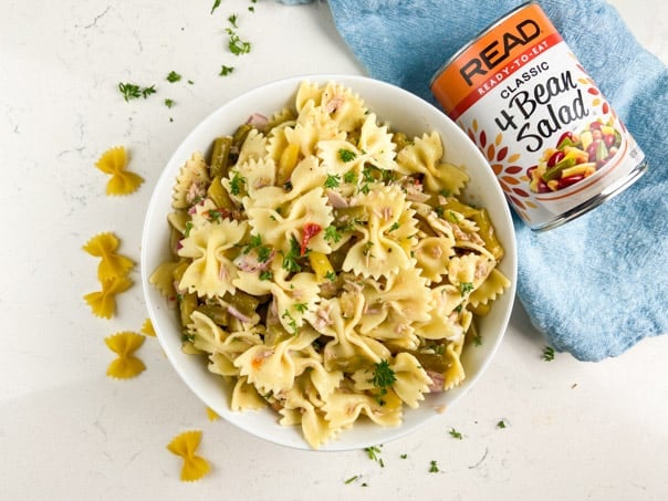 Easy pasta salad made with 4-bean salad, pasta, tuna, red onion, and parsley.