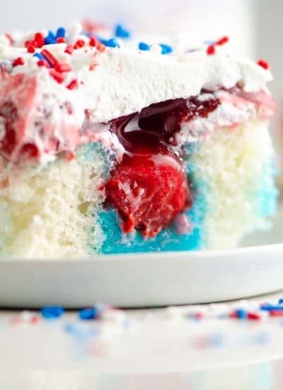 A slice of red, white, and blue, Patriotic Poke Cake.