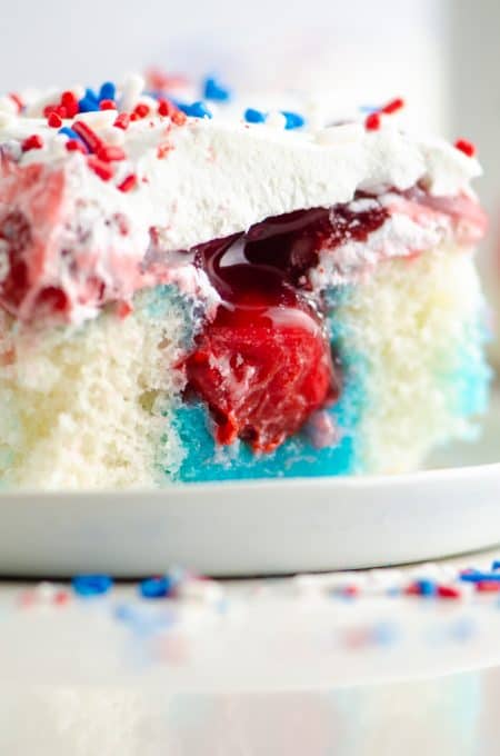 A slice of red, white, and blue, Patriotic Poke Cake.
