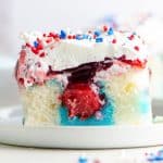 Patriotic Poke Cake with cherry fruit filling.