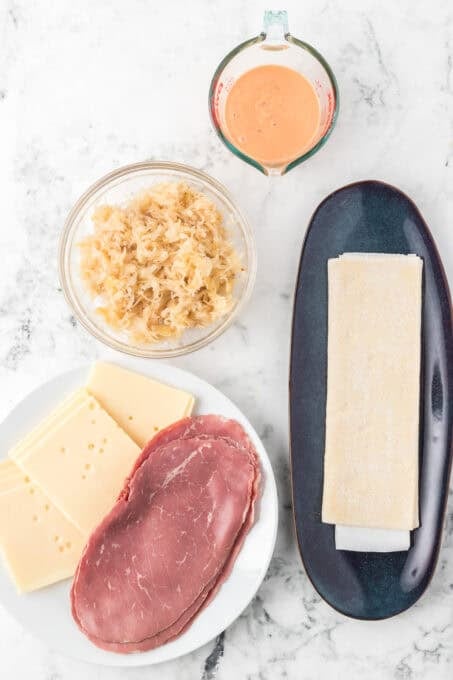 Ingredients for a Reuben sandwich in a puff pastry.