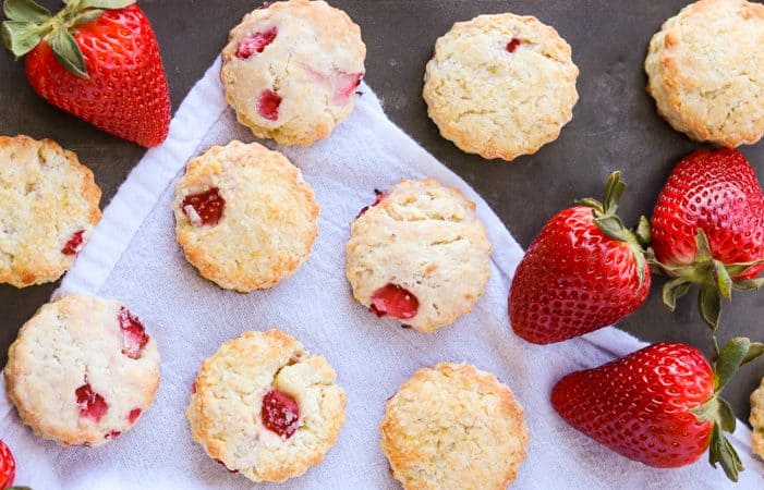 An tray of scones made with strawberries, cream cheese and lemon zest.