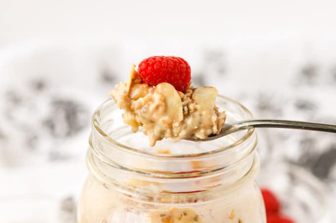 A raspberry on top of some banana overnight oats.