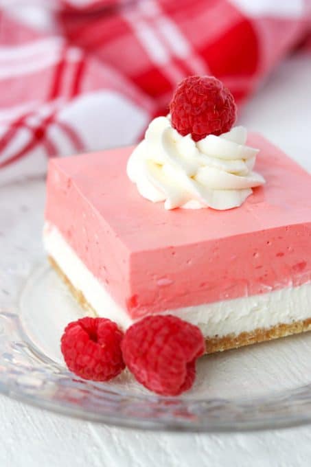 Sweet delicious layers in a creamy raspberry no bake jello dessert.