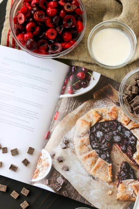 Making a galette with cherries and dark chocolate.