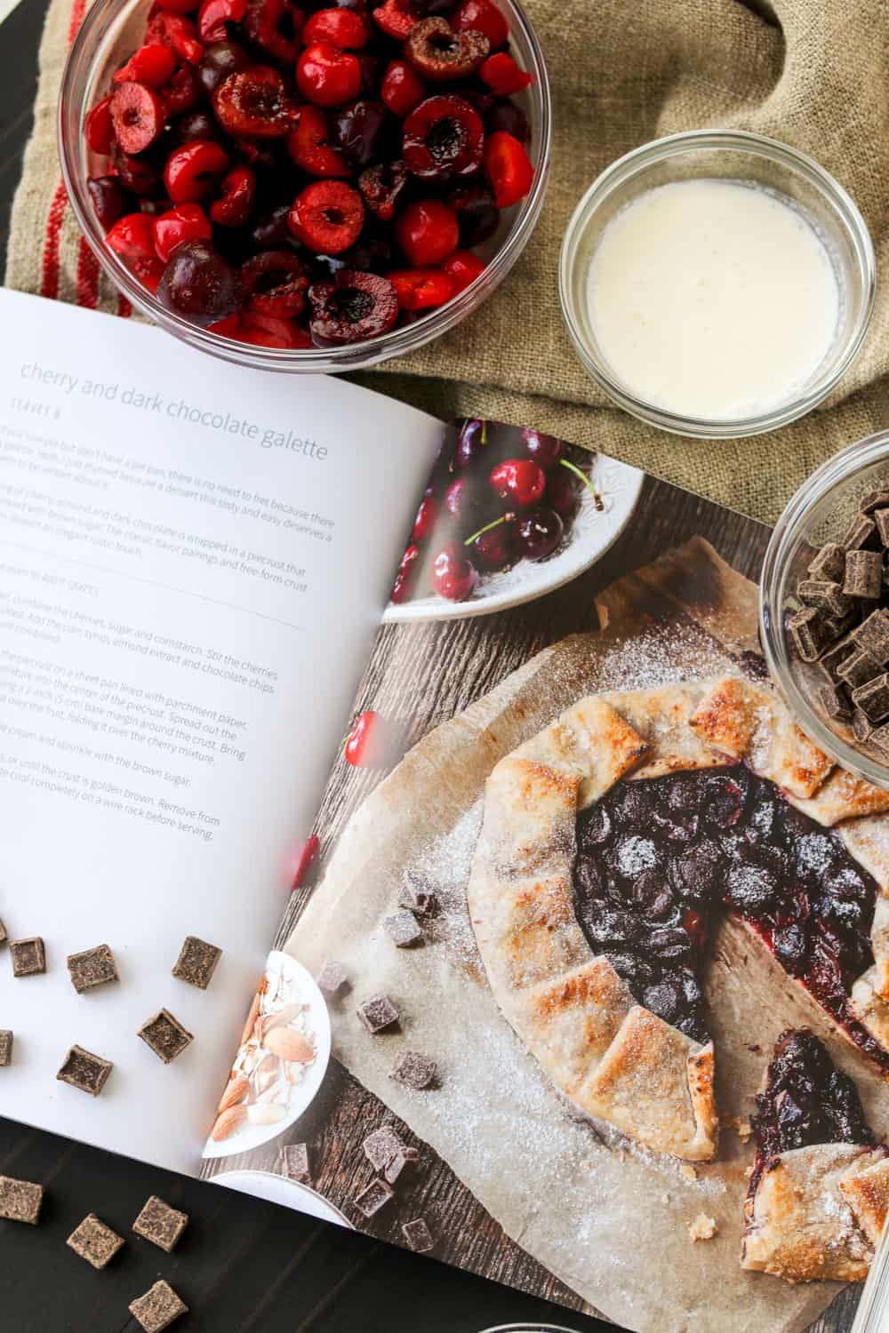 Making a galette with cherries and dark chocolate.