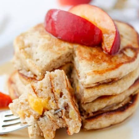 A bite of Cinnamon Peach Pancakes.