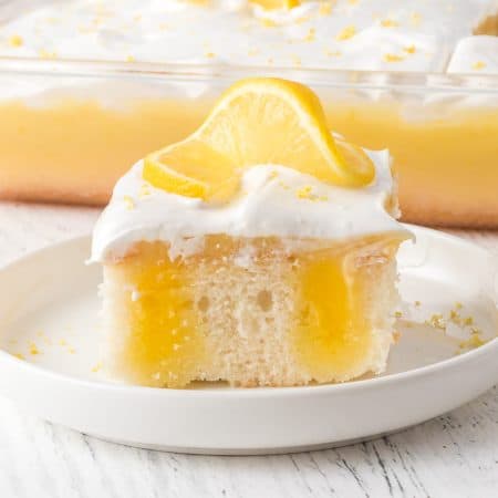 Lemon Poke Cake with Marshmallow Frosting.