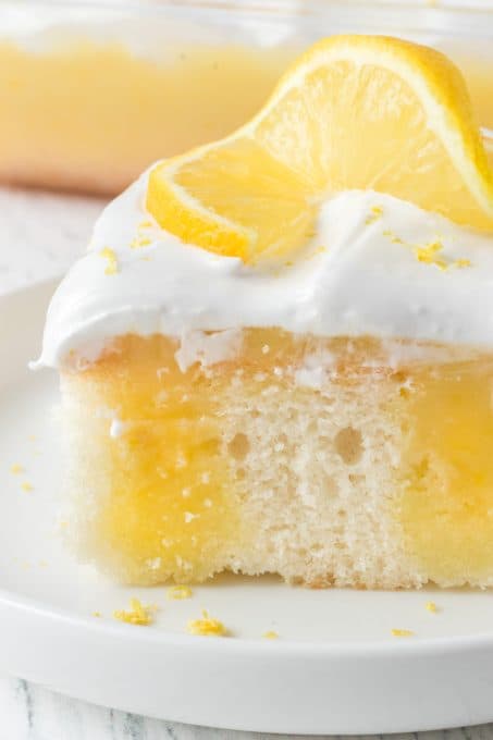 Lemon Poke Cake with Marshmallow Frosting.