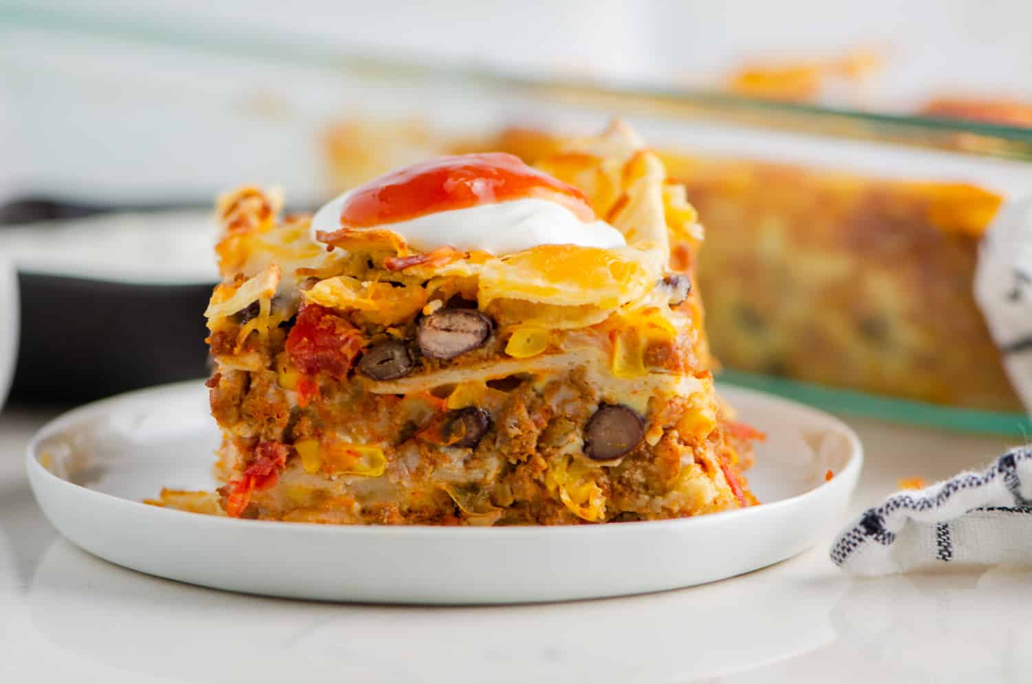 Breakfast Casserole with tortillas, eggs, cheese, and chorizo.