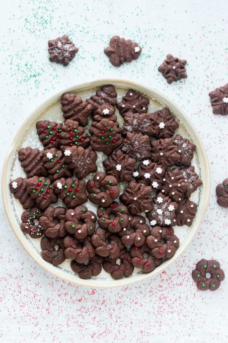 A plate full of chocolate cookies.