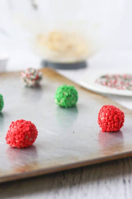 Balls of colored sprinkle cookies.