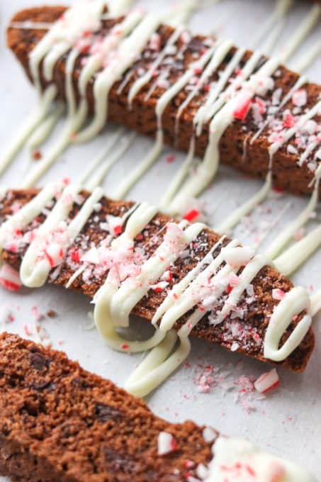 Chocolate biscotti drizzled in white chocolate and sprinkled with crushed candy canes.