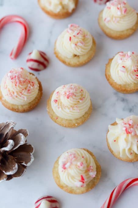 Cookies cups with peppermint frosting and candy cane kisses.