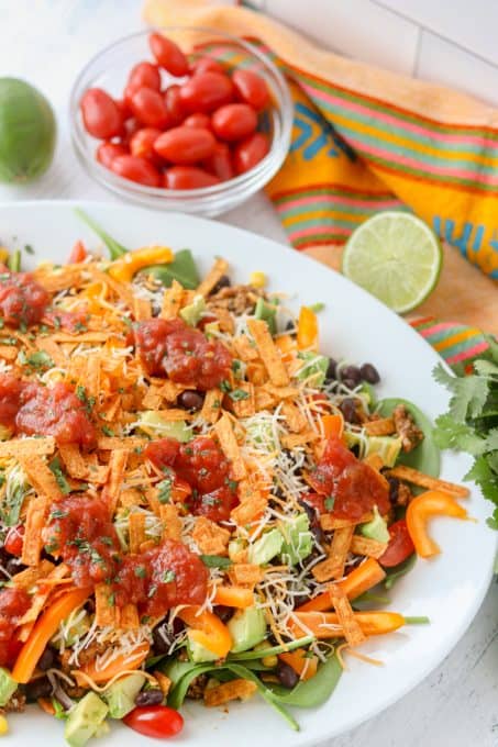 A loaded taco salad with chicken.