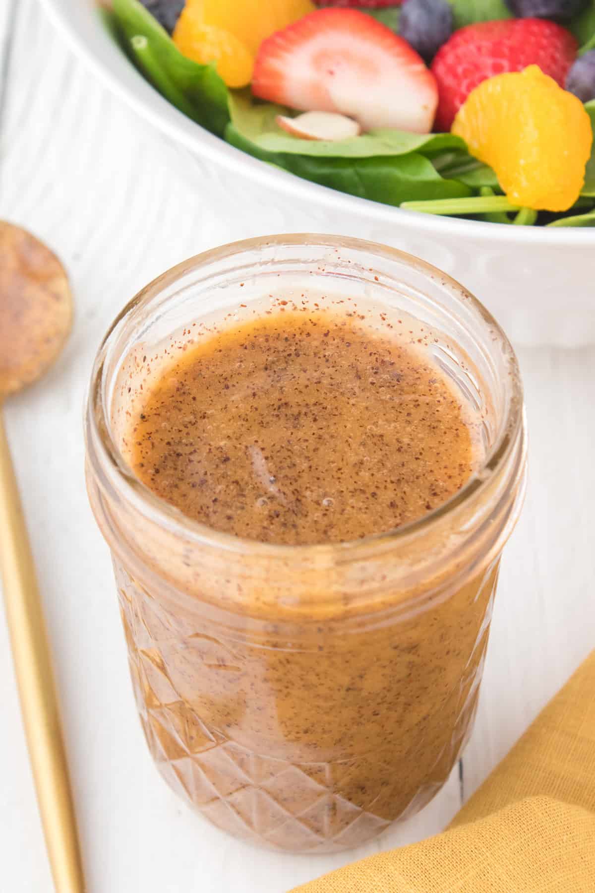 A jar of poppy seed salad dressing.