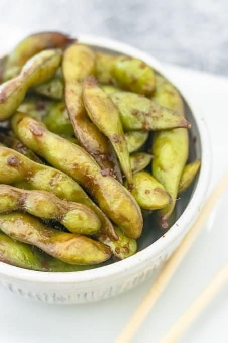 Edamame pods sautéed in soy sauce and minced garlic.