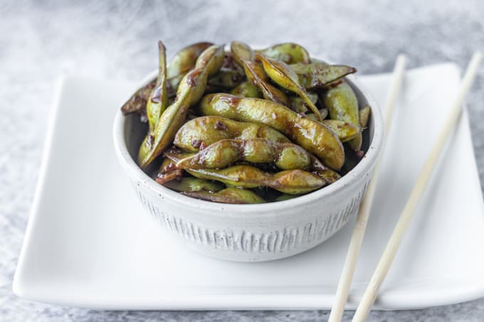 A soy sauce edamame appetizer.