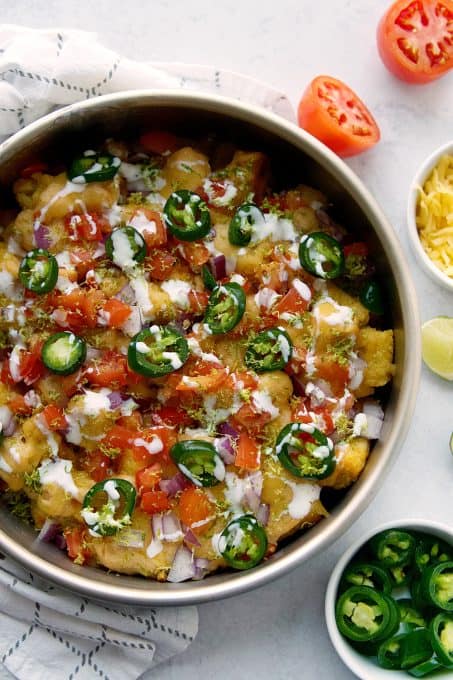 Totchos with homemade queso and toppings.