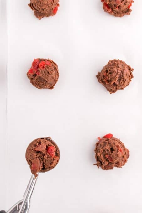 Chocolate Cake Cookies with cherries ready for the oven.