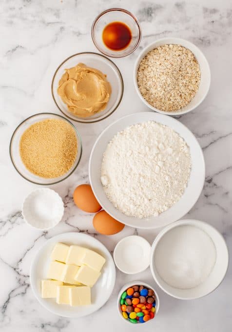 Ingredients for oatmeal cookies with peanut butter and M&M's.