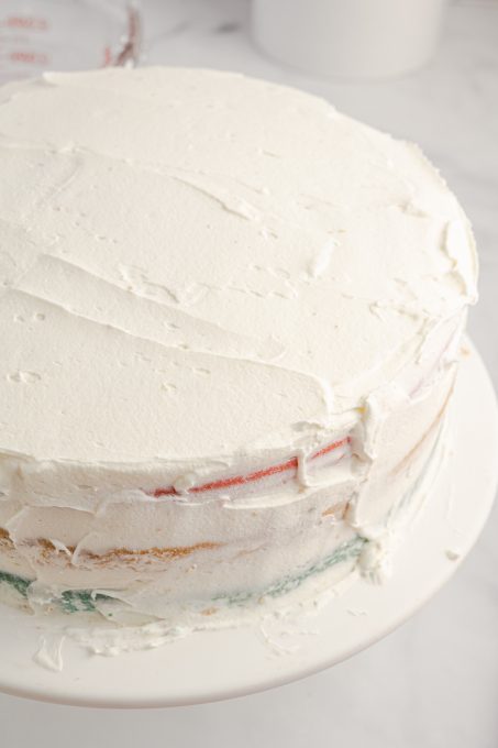 The crumb coat on a layer cake for a patriotic celebration.