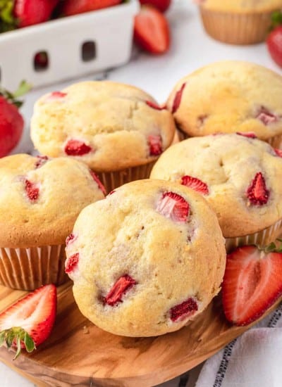 Muffins made with sour cream and fresh strawberries.