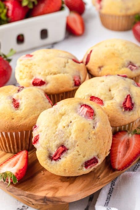 Muffins made with sour cream and fresh strawberries.