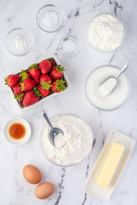 Ingredients for sour cream muffins with strawberries.