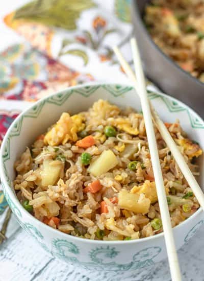 Fried Rice in a bowl with chopsticks.
