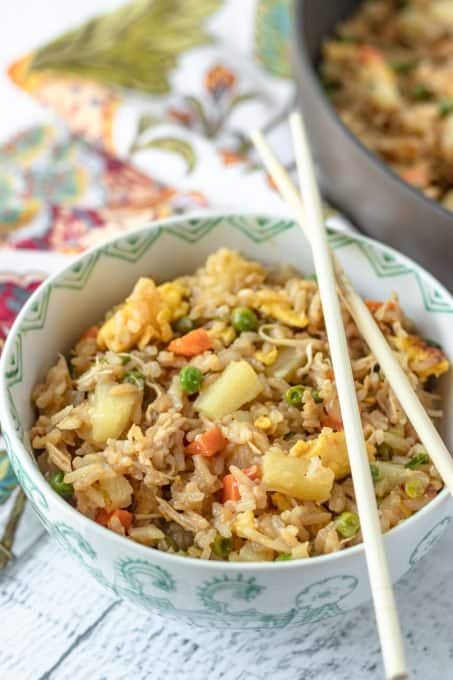 Fried Rice in a bowl with chopsticks.