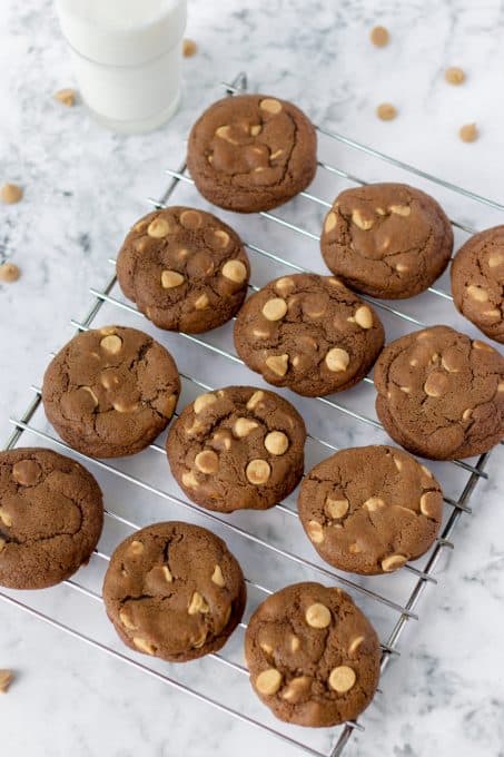 Chocolate Peanut Butter Chip Cookies cooling on a rack.