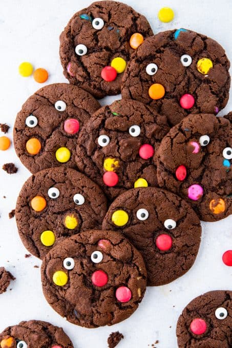 Chocolate cookies with M&M's and candy eyes.