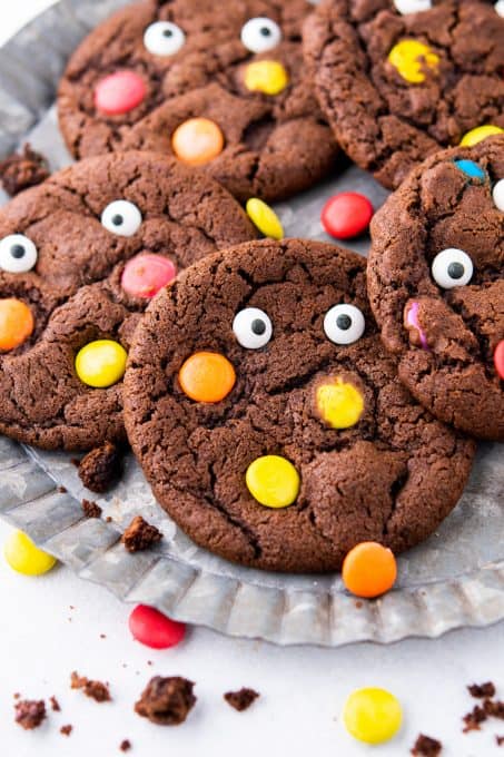 Chocolate M&M cookies with candy eyes.