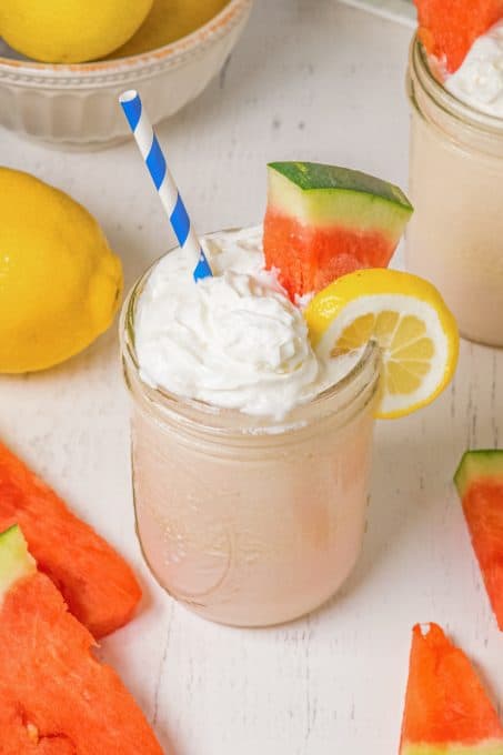 An ice cold glass of frosted lemonade with watermelon.