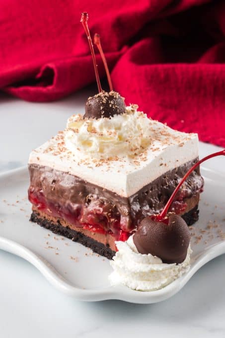 Chocolate covered cherries with chocolate cheesecake, chocolate pudding, and whipped topping.