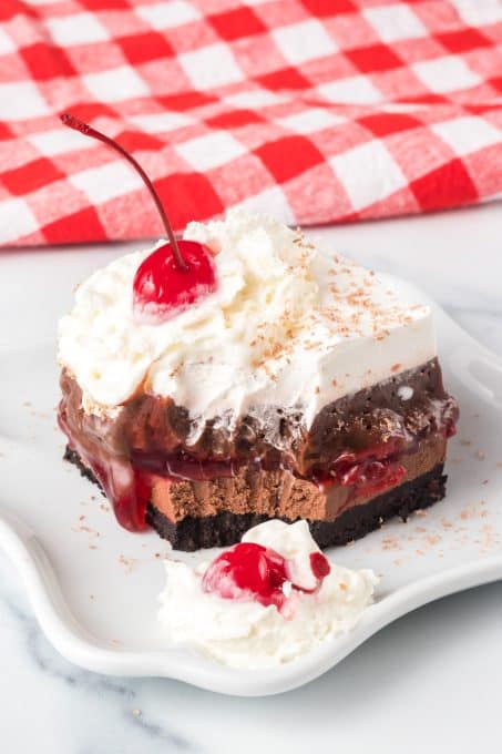 Chocolate cheesecake, cherries, and chocolate pudding.