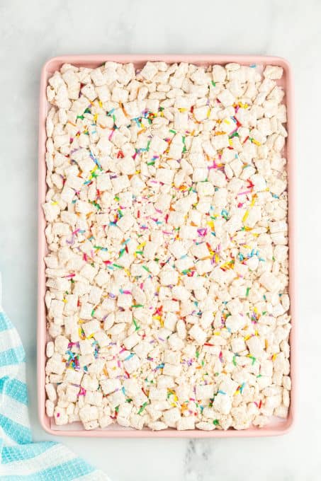 Funfetti Muddy Buddies on a baking sheet.