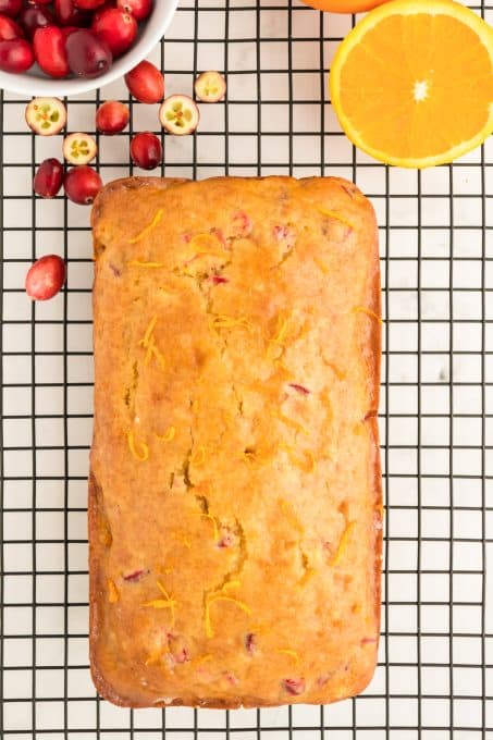 A loaf of bread with orange and chopped cranberries