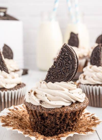 Unwrapping a chocolate cupcake made with Oreos