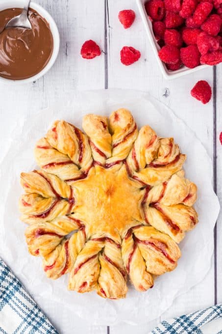 A celebration bread with raspberries and jam.